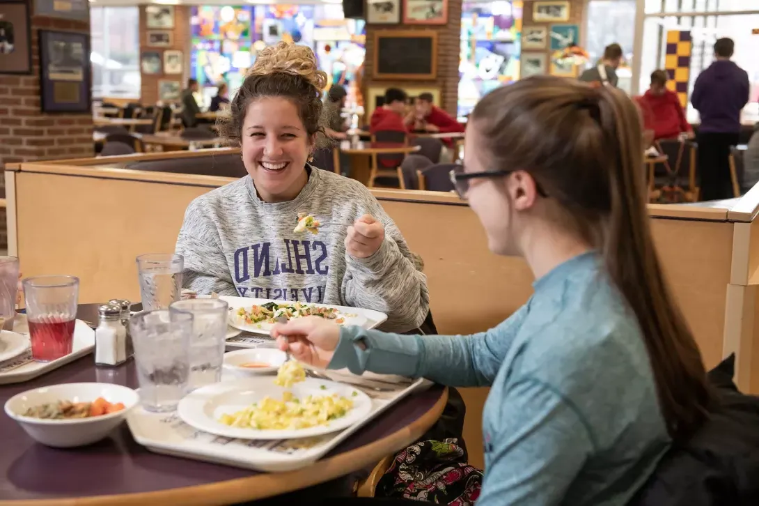 Students eating in Convo